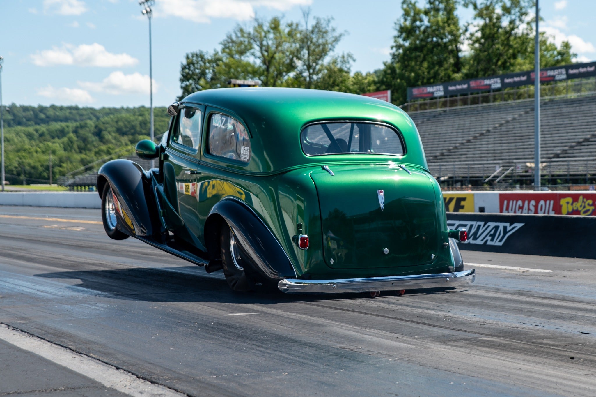 1937 Chevy sedan is the old Moose car and leaves on the buper every pass